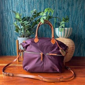 Plum nylon Dooney & Bourke large pocket satchel with crossbody strap.